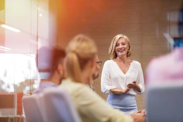 Businesswoman leading a recruitment meeting with team members.